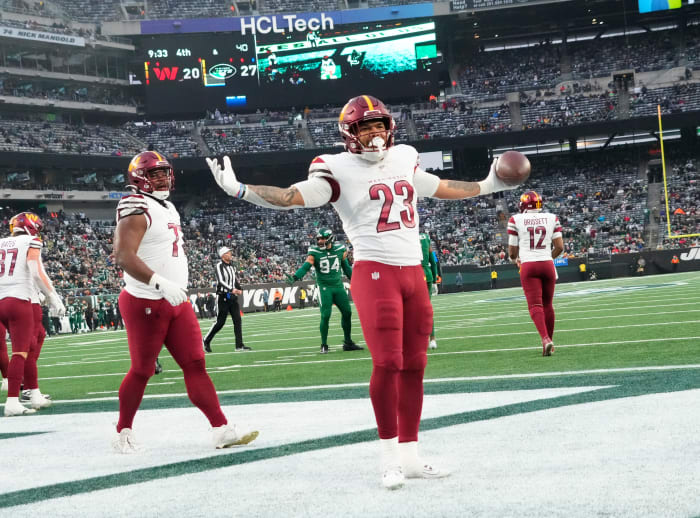 Washington Commanders running back Chris Rodriguez Jr. (23) celebrates a second half touchdown against the New York Jets at MetLife Stadium. Mandatory Credit: Robert Deutsch-USA TODAY Sports